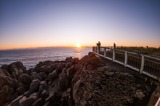 Walkway on the sea with a sunset