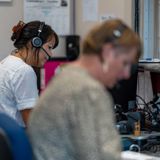 Two women at a customer service center on the phone